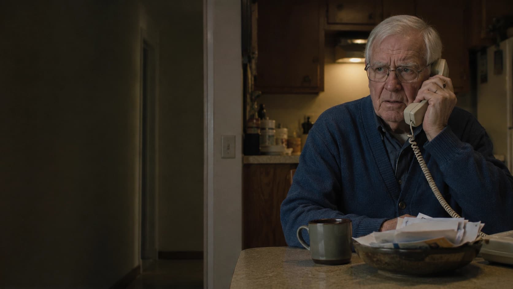 Family caregiver on the phone after receiving an urgent alert